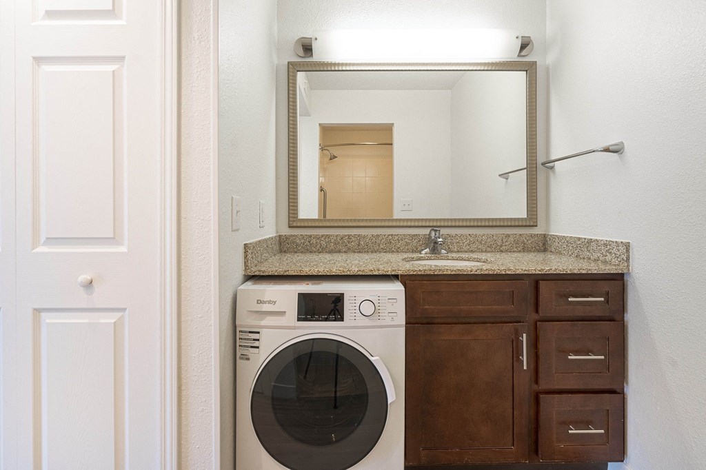 a bathroom with a washer and dryer